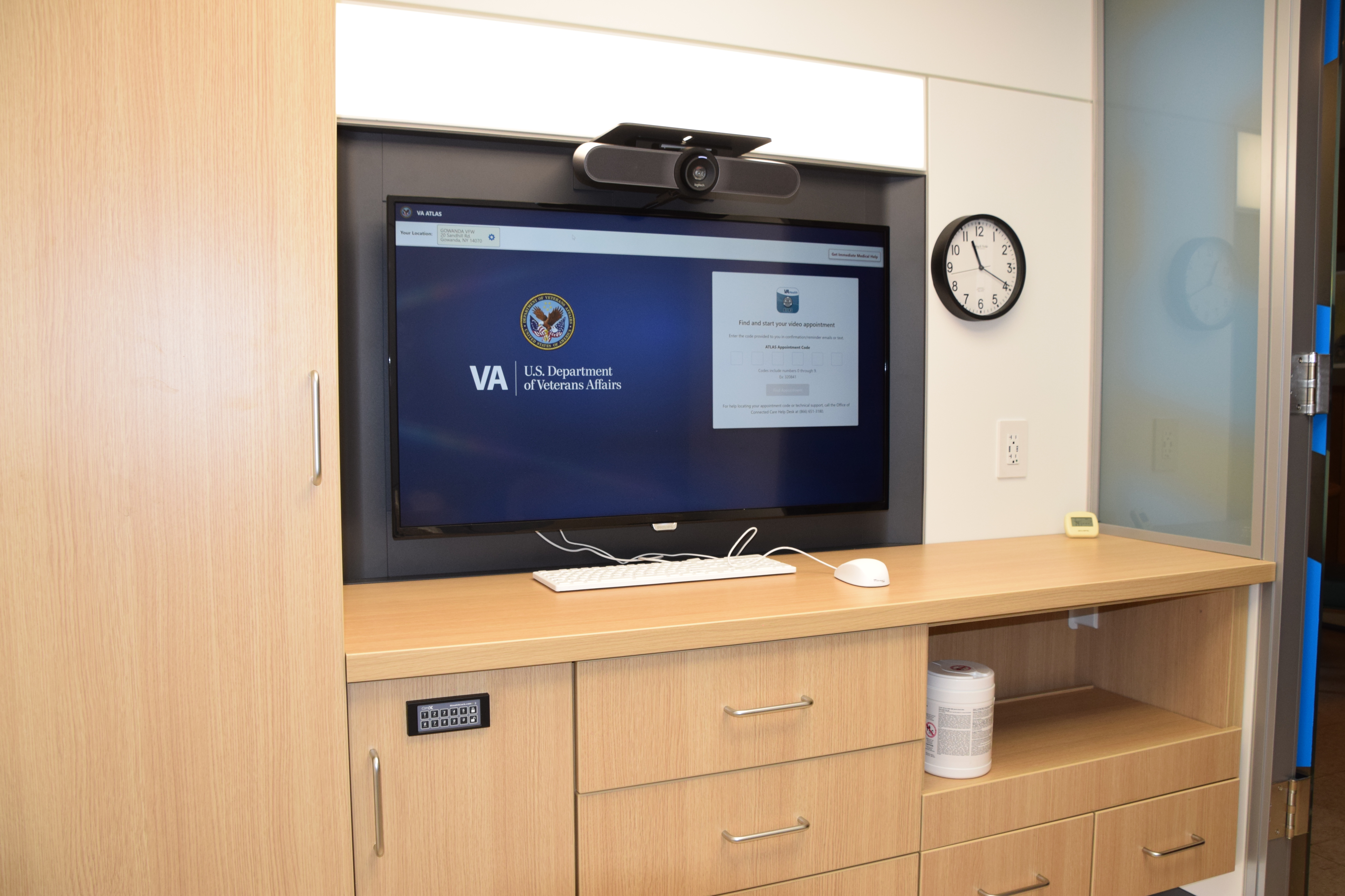 A TV on a console within a private space for veterans