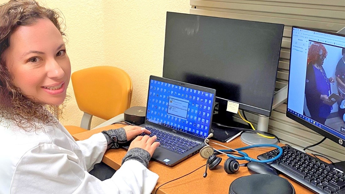 Dr. Samara Martinez working at a desk. 