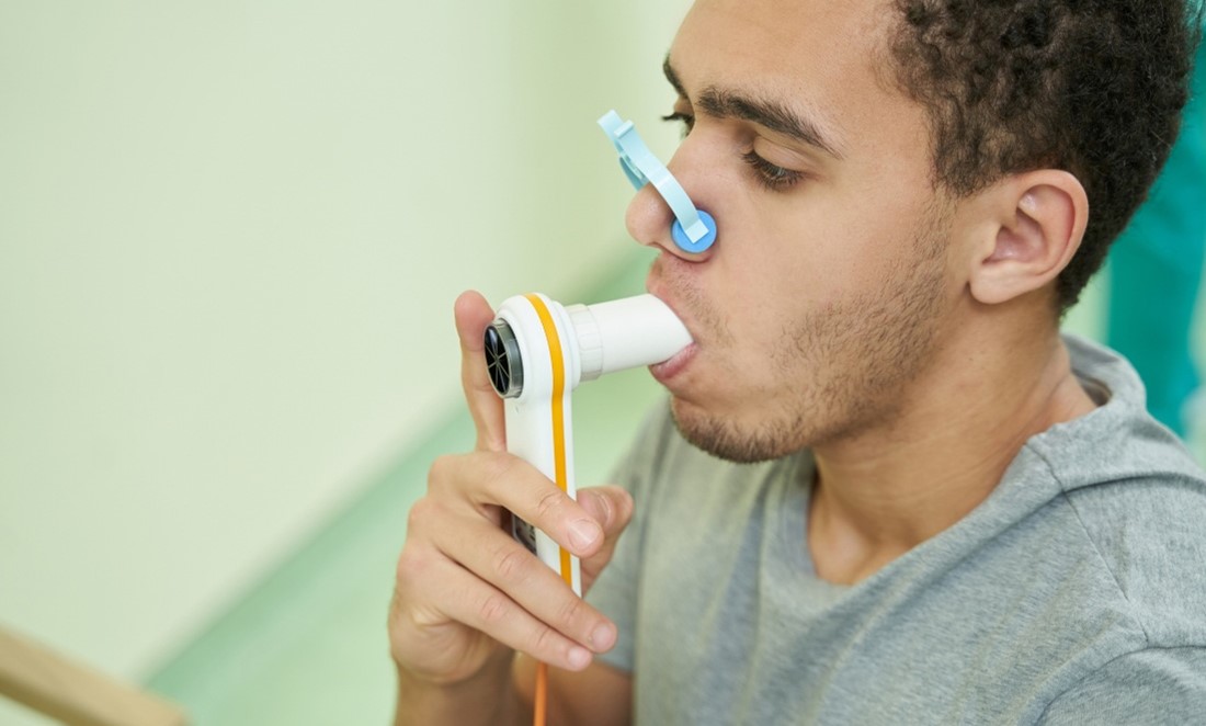 Veteran taking a spirometry test.