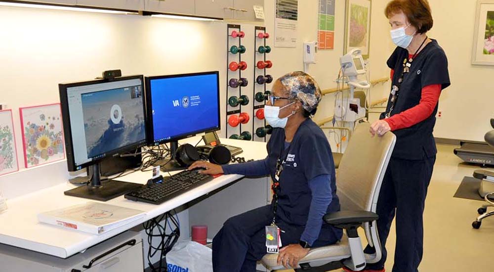 Nurses in VA facility speak to Veteran through their computer