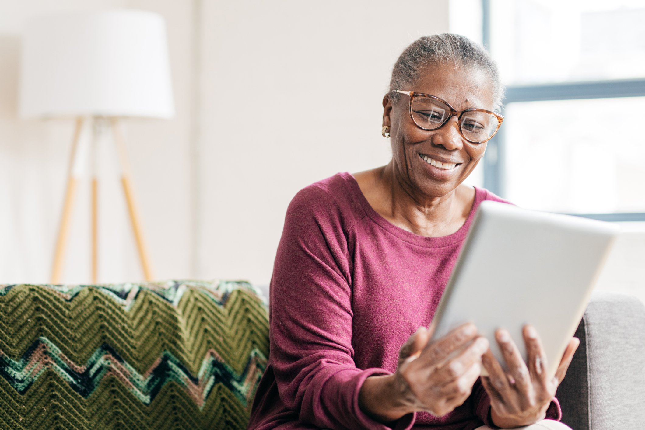 Woman looking at tablet.