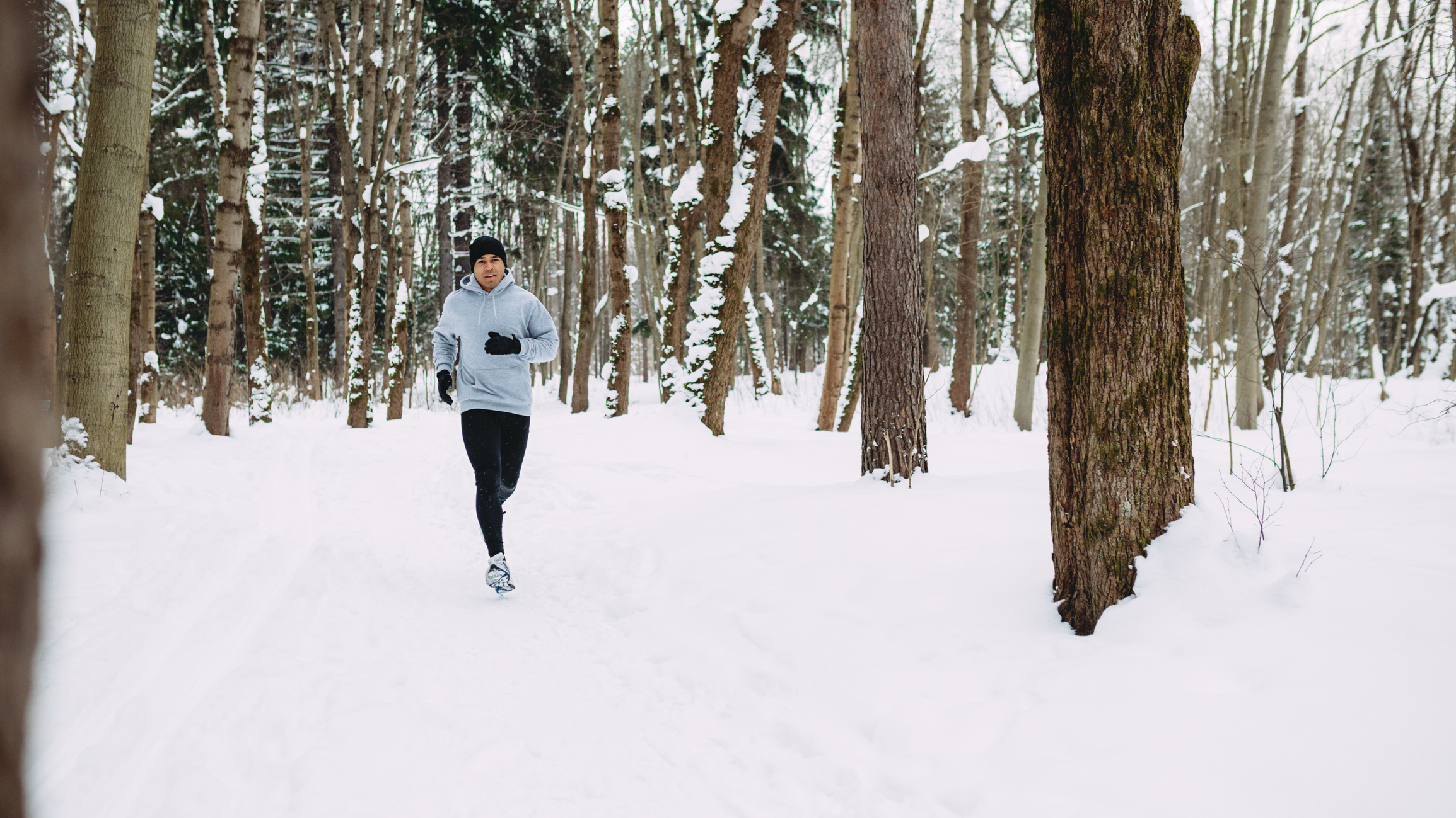 A man running in the snow. 