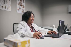 Health Care Professional in an office using a laptop