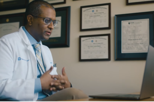 Oncology doctor speaks to patient by video