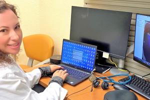 Dr. Samara Martinez working at a desk. 