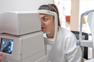 A woman taking an eye test. 