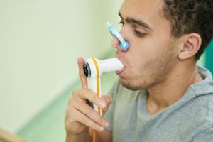 Veteran taking a spirometry test.