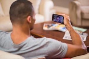 Man talking to a VA provider by video on his cell phone