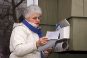 A woman checking her mail.