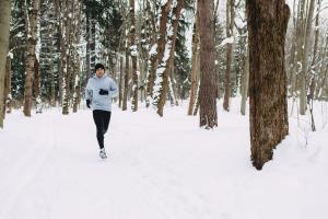 A man running in the snow. 