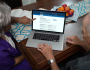 A couple looking at the My HealtheVet homepage. 