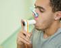 Veteran taking a spirometry test.