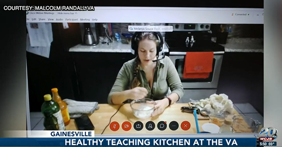 Women sits in front of mixing bowl and gives cooking lessons on camera