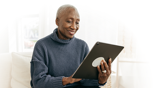 elder african-american woman holding a tablet
