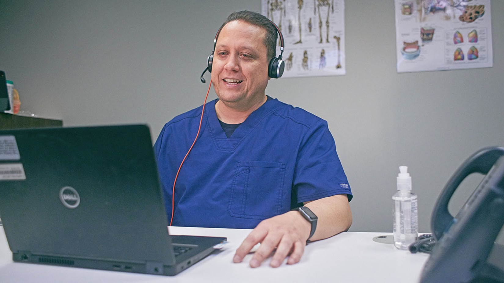 A provider in his office on a telehealth virtual call.
