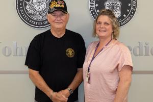 Army Veteran Robert Cutchins stands with RPM-HT Care Coordinator Kristin Moser