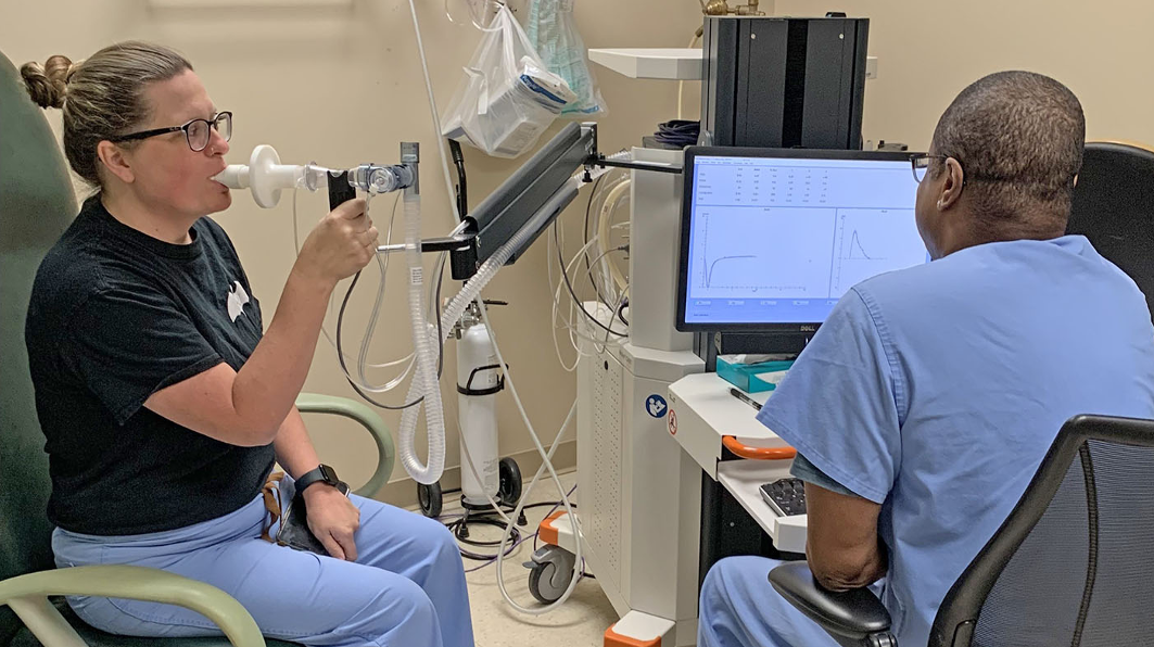 Health Care Professional with a patient performing Spirometry test